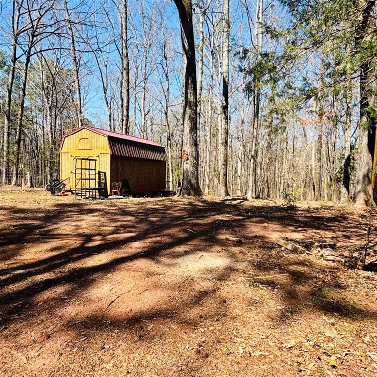 307 Floyd Road Forsyth, GA 31029 - Photo 11 of 12 a view of a house with a yard