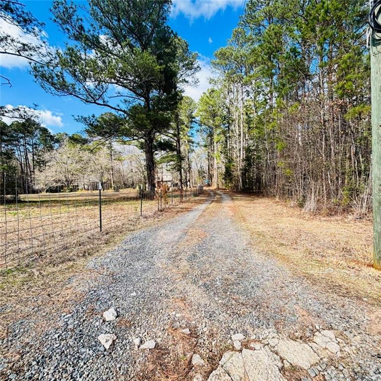 307 Floyd Road Forsyth, GA 31029 - Photo 2 of 12 a view of outdoor space with trees
