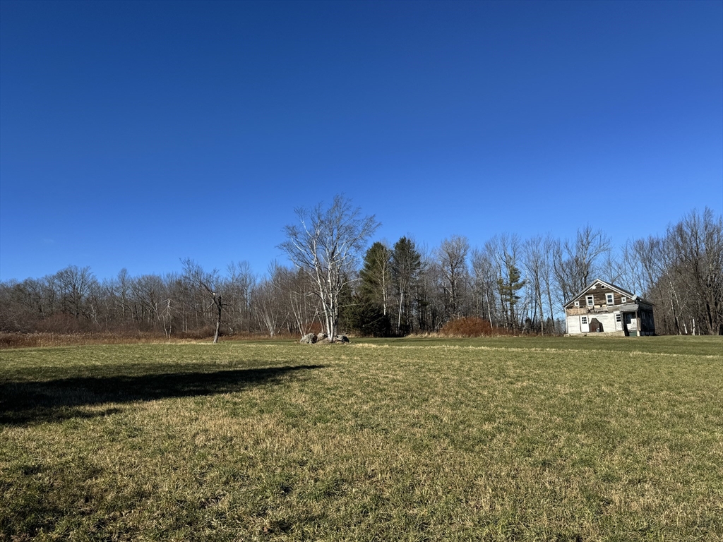 292 East Hawley Road Hawley, MA 01339 - Photo 4 of 7 a view of a lake with trees in the background
