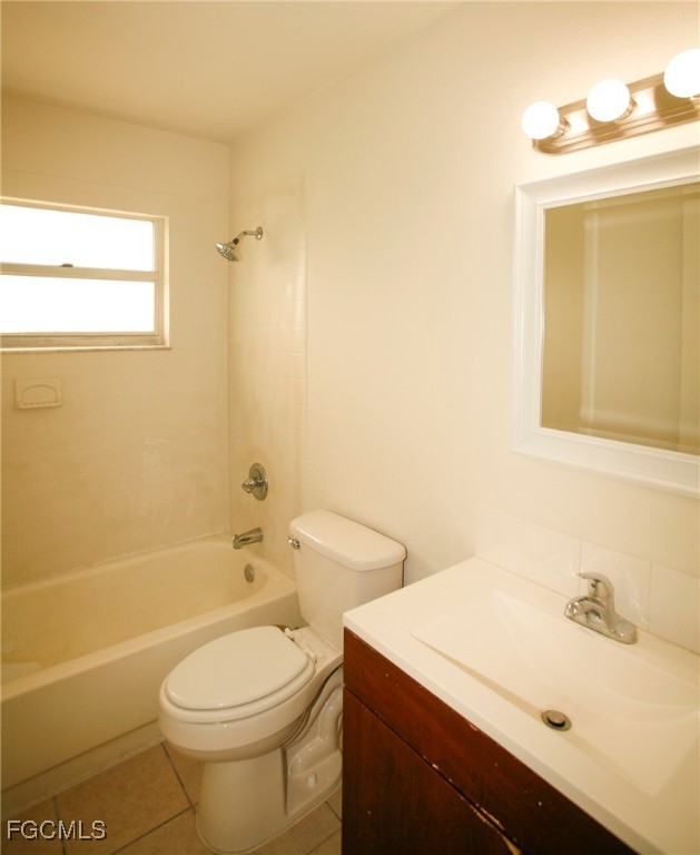 122 Gordon Avenue South Lehigh Acres, FL 33973 - Photo 11 of 12 a bathroom with a sink a toilet and shower