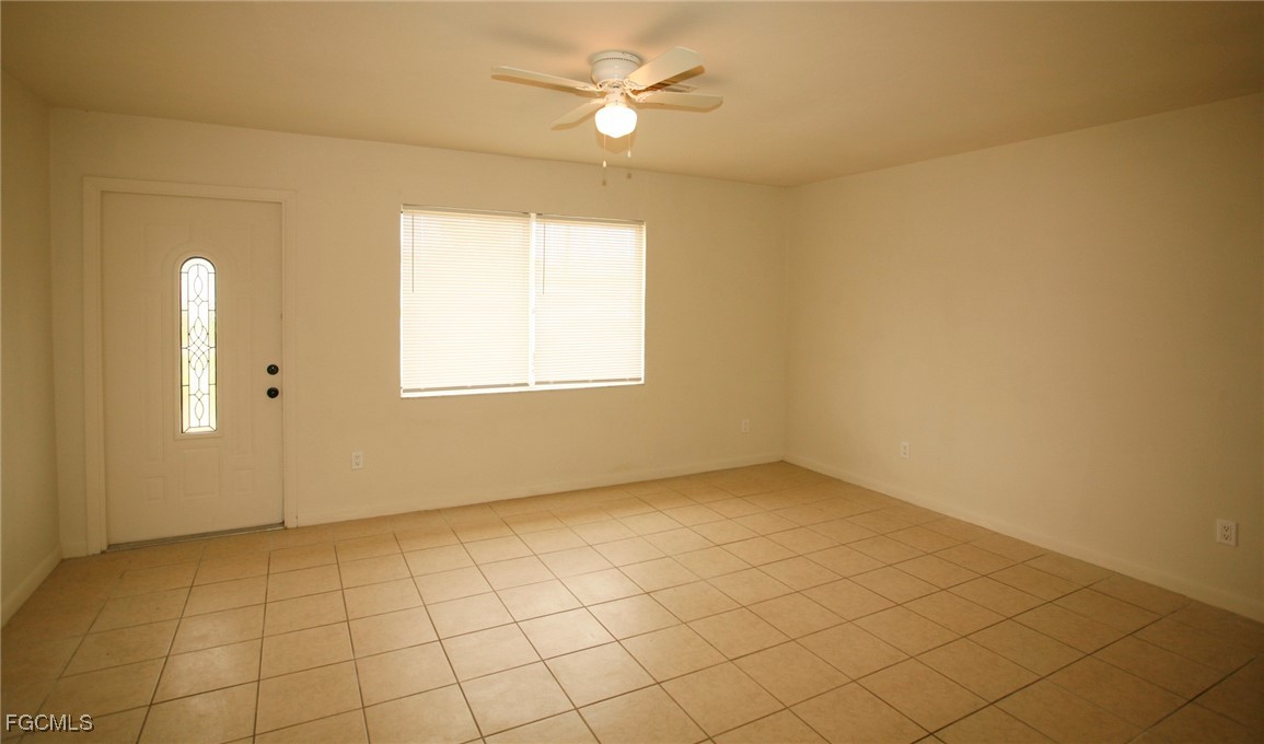 122 Gordon Avenue South Lehigh Acres, FL 33973 - Photo 2 of 12 a view of an empty room with a window