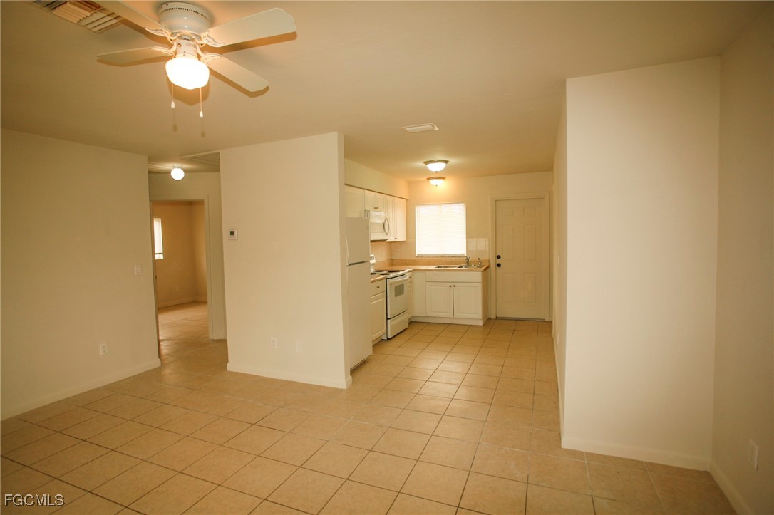 122 Gordon Avenue South Lehigh Acres, FL 33973 - Photo 4 of 12 a view of a kitchen with a sink and cabinets