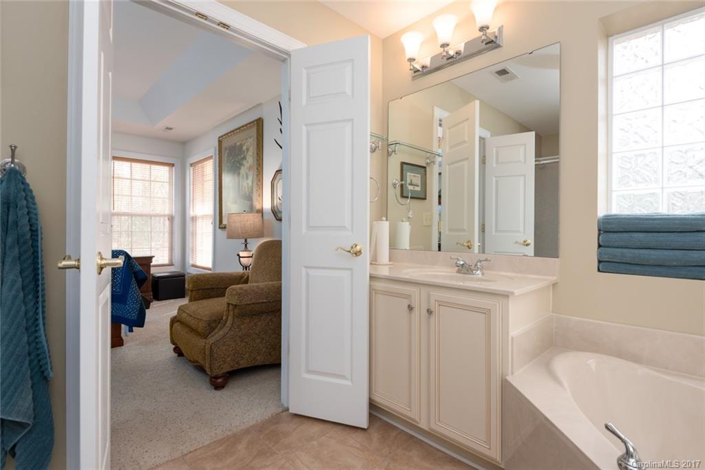 4630 Old Hickory Road Lancaster, SC 29720 - Photo 11 of 22 a en suite spacious bathroom with a double vanity sink tub and mirror