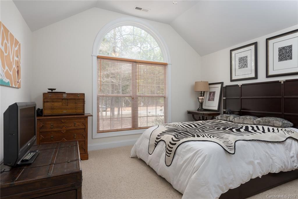 4630 Old Hickory Road Lancaster, SC 29720 - Photo 12 of 22 a bedroom with a bed next to a window with a flat tv screen on dresser