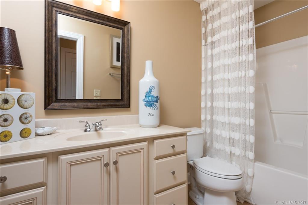 4630 Old Hickory Road Lancaster, SC 29720 - Photo 14 of 22 a bathroom with a sink a toilet and a mirror