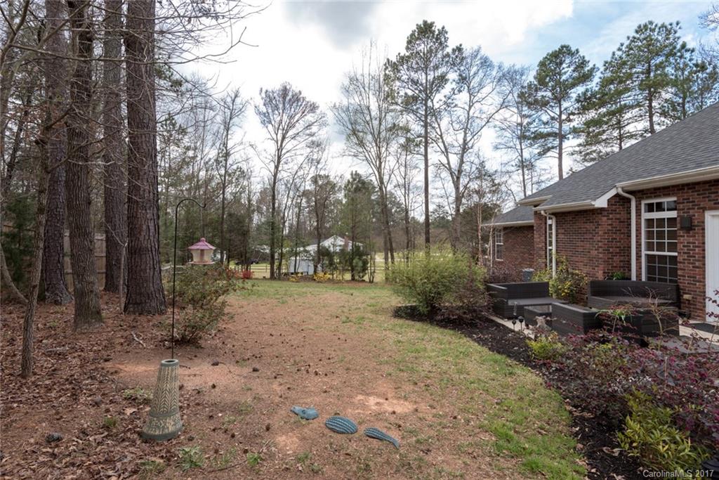 4630 Old Hickory Road Lancaster, SC 29720 - Photo 21 of 22 a backyard of a house with lots of green space