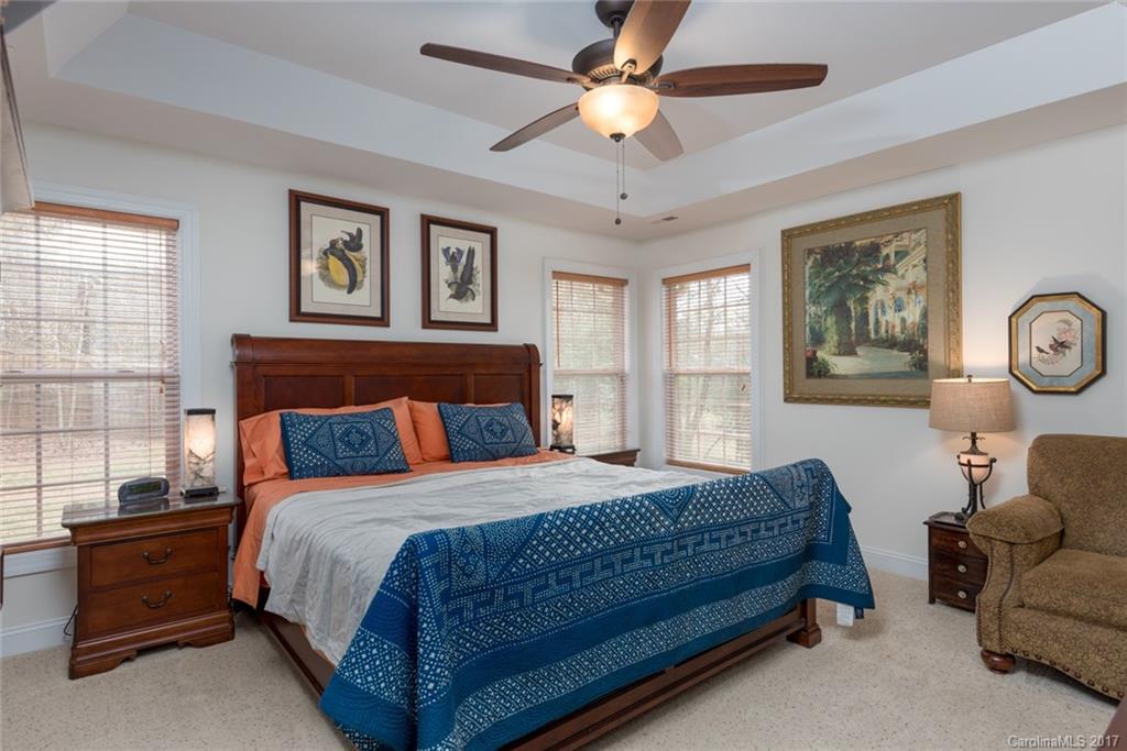 4630 Old Hickory Road Lancaster, SC 29720 - Photo 10 of 22 a bedroom with a bed and a chandelier