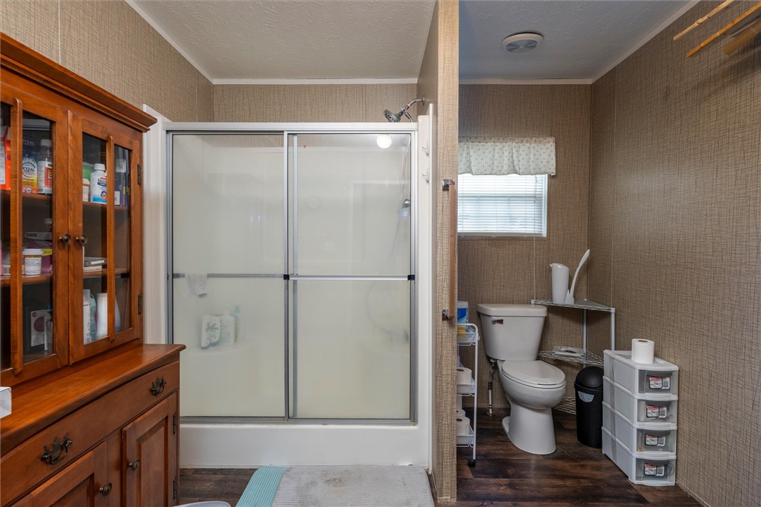 1926 Fairview Road Peebles, OH 45660 - Photo 24 of 44 This functional bathroom features a shower with sliding doors and ample natural light.