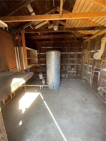 a view of a room with wooden shelves