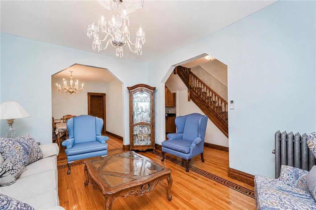 1352 Bay Ridge Parkway Brooklyn, NY 11228 - Photo 11 of 42 a living room with furniture and a chandelier