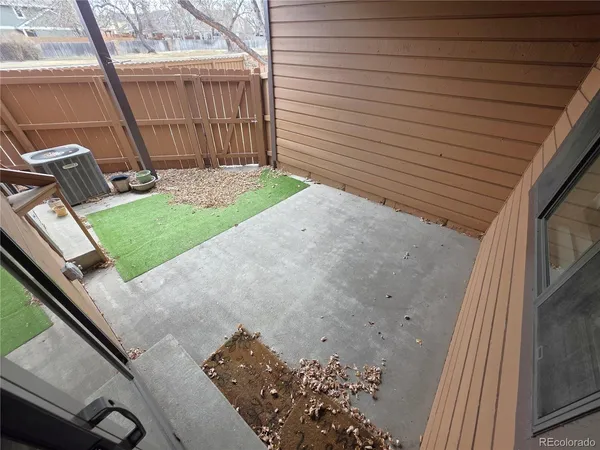a view of a backyard with sitting area