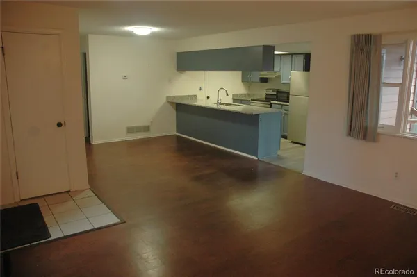 a kitchen with stainless steel appliances a sink stove and cabinets