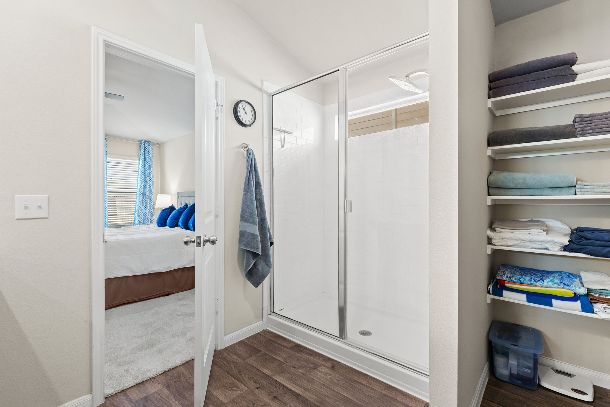 404 Cassandra Drive Hutto, TX 78634 - Photo 18 of 40 Ensuite bathroom featuring a shower stall and dark wood-style flooring