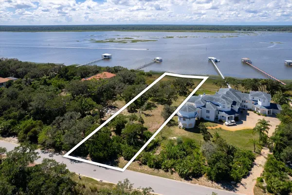 an aerial view of house with yard swimming pool and outdoor seating