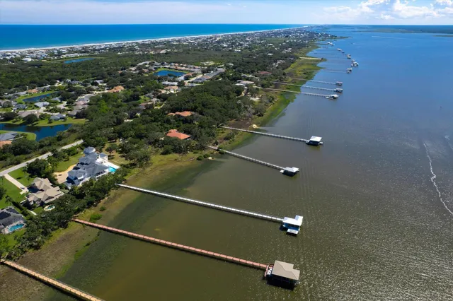 an aerial view of residential houses with city view