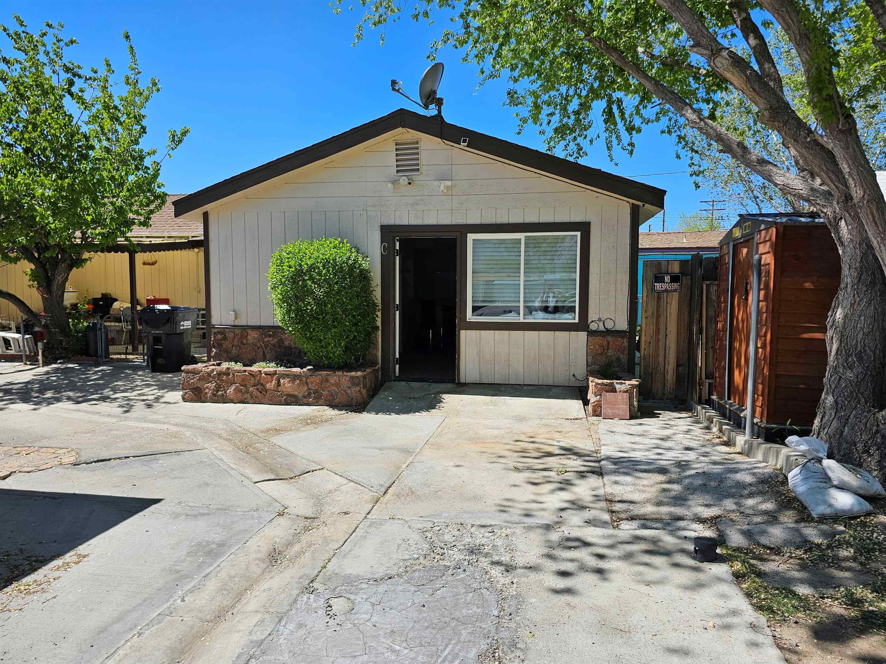 331 South Warren Street Bishop, CA 93514 - Photo 3 of 22 a front view of a house with a yard and potted plants
