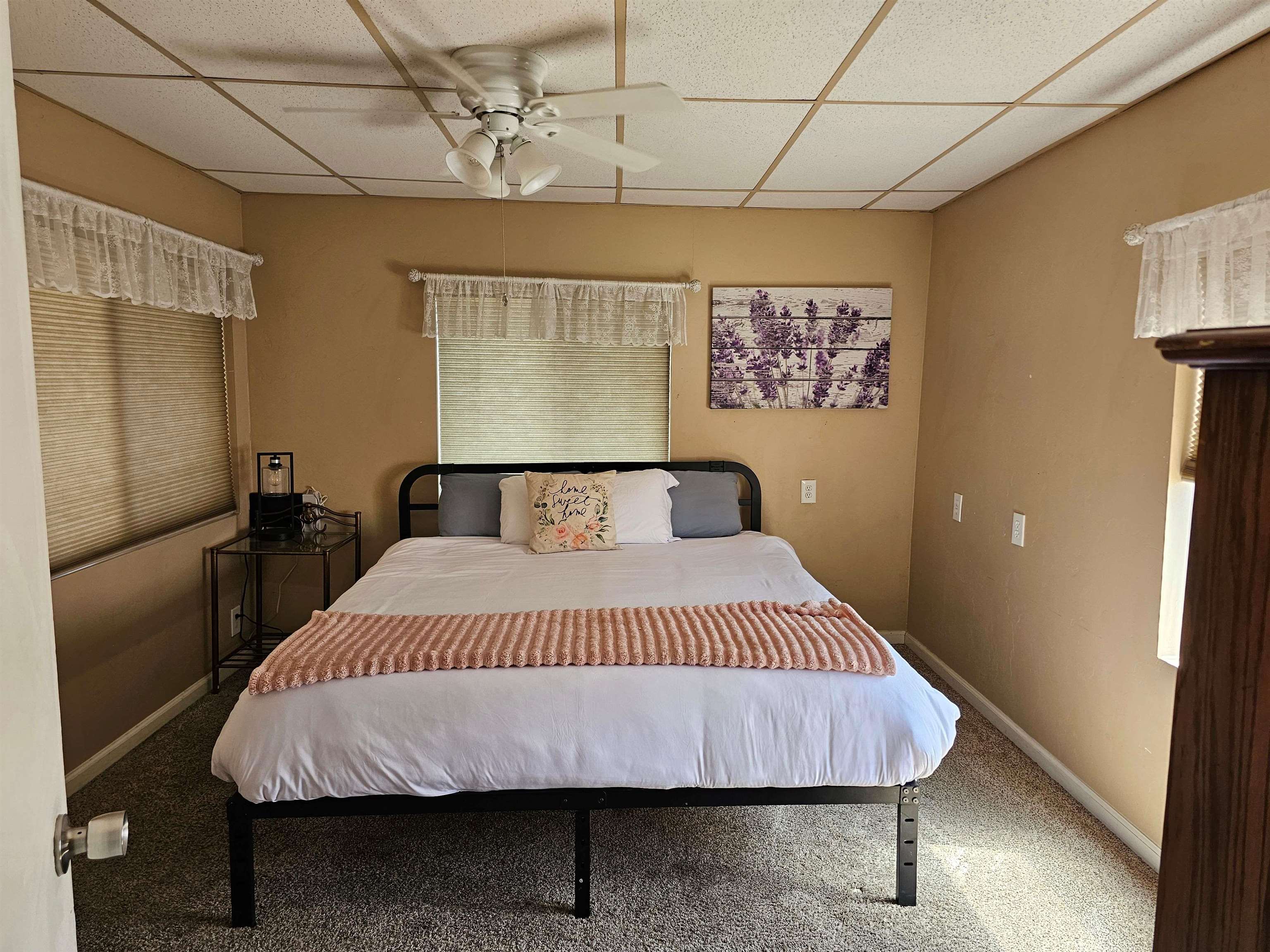 331 South Warren Street Bishop, CA 93514 - Photo 10 of 22 a bedroom with a bed and wooden floor