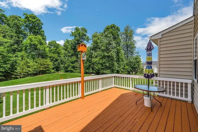 a view of balcony with wooden floor