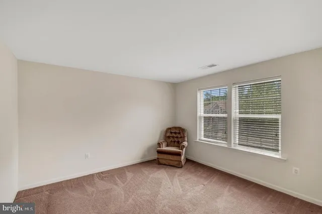 a view of a room with windows