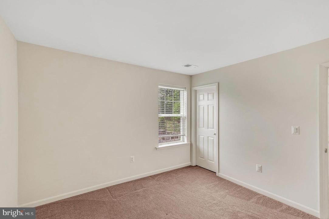 18776 Pier Trail Drive Triangle, VA 22172 - Photo 22 of 32 a view of an empty room with a window