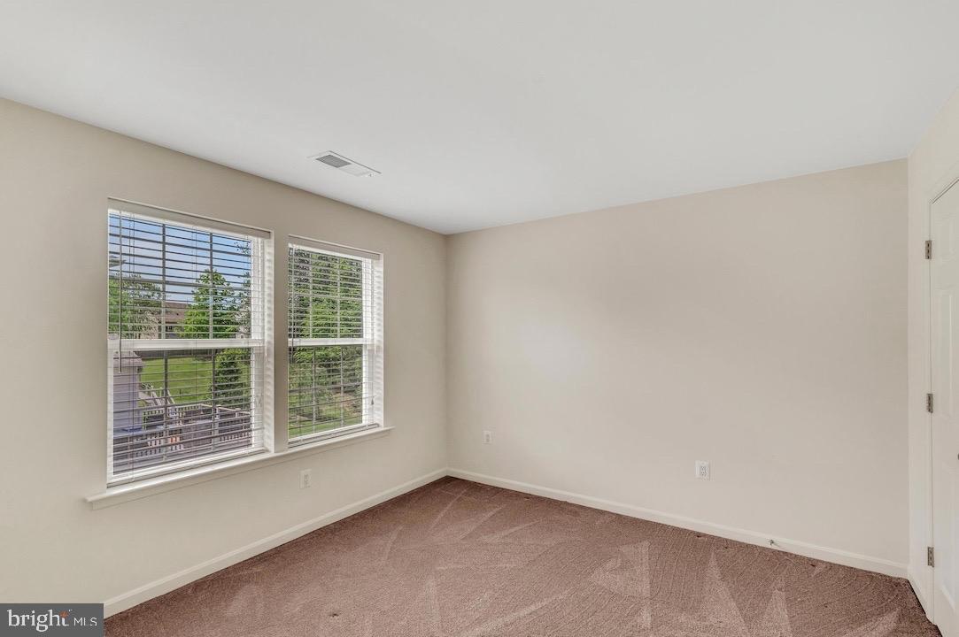 18776 Pier Trail Drive Triangle, VA 22172 - Photo 24 of 32 an empty room with windows