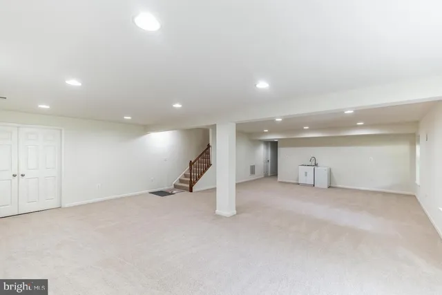 an empty room with a kitchen