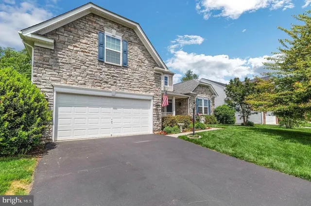 a front view of a house with yard
