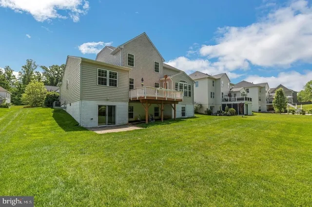 a view of a house with a back yard