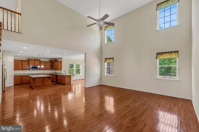 a view of livingroom with furniture wooden floor and a ceiling fan
