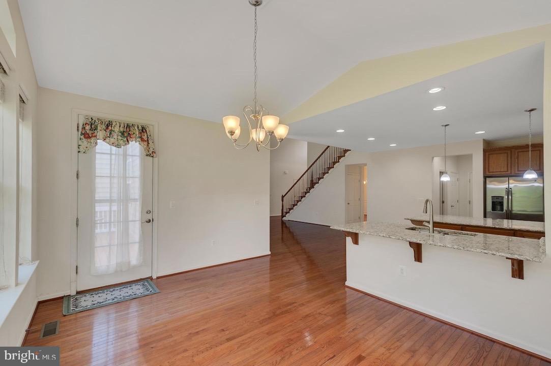 18776 Pier Trail Drive Triangle, VA 22172 - Photo 10 of 32 a view of a room with wooden floor and staircase