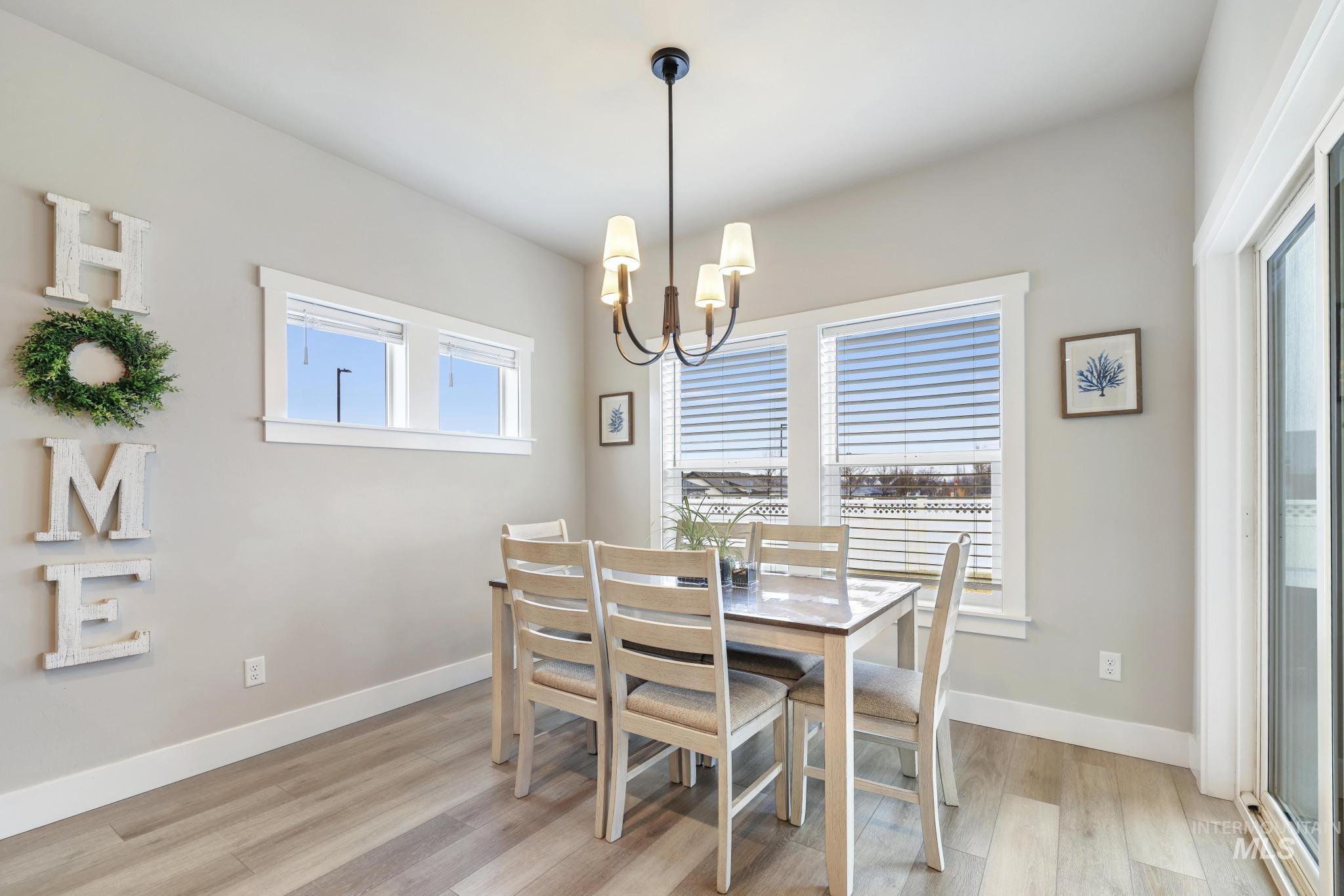 3103 Moonrise Road Twin Falls, ID 83301 - Photo 13 of 42 Dining area with light wood-style flooring and hanging lights