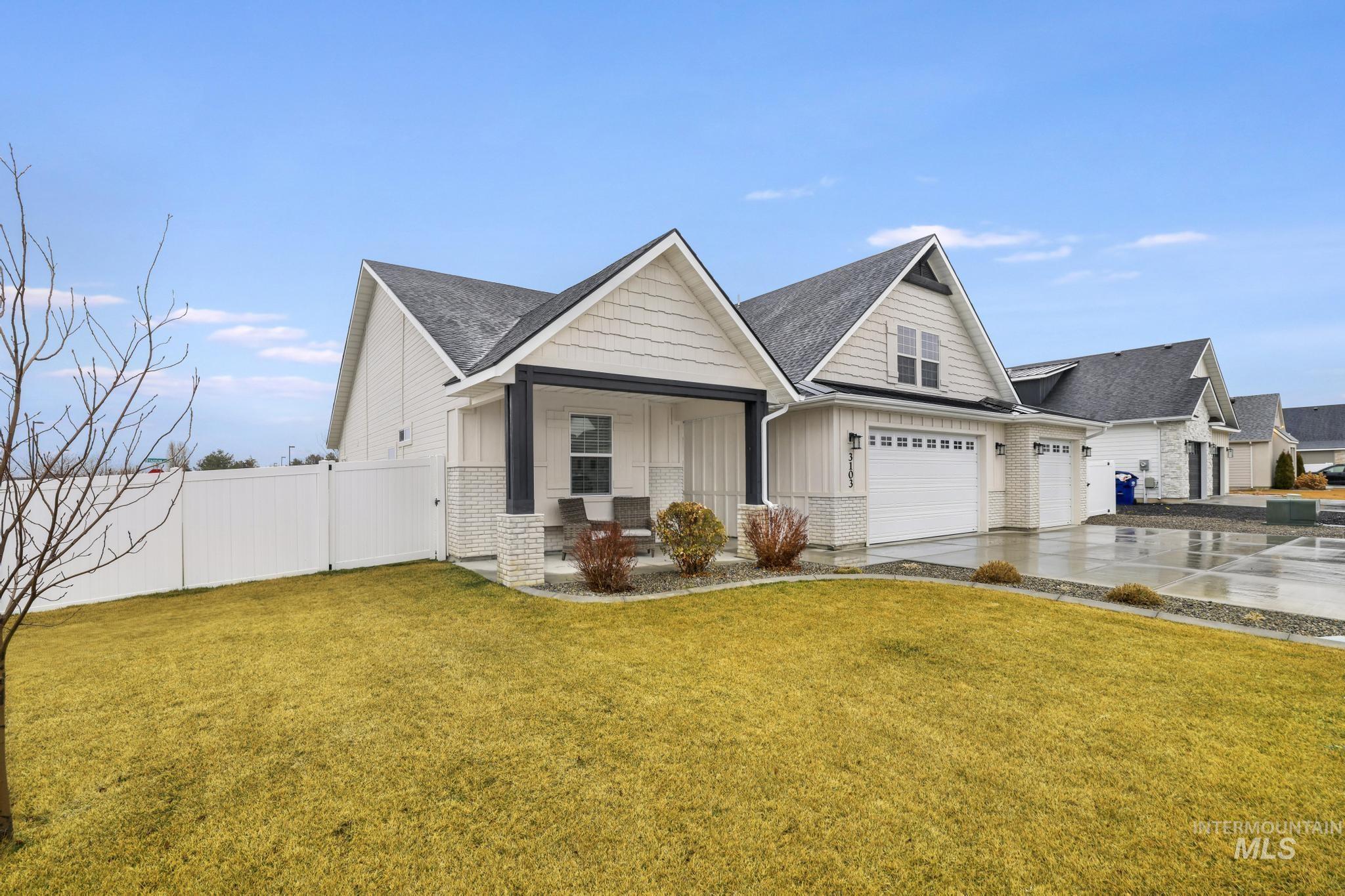 3103 Moonrise Road Twin Falls, ID 83301 - Photo 2 of 42 View of front of property with concrete driveway, board and batten siding, roof with shingles, and covered porch