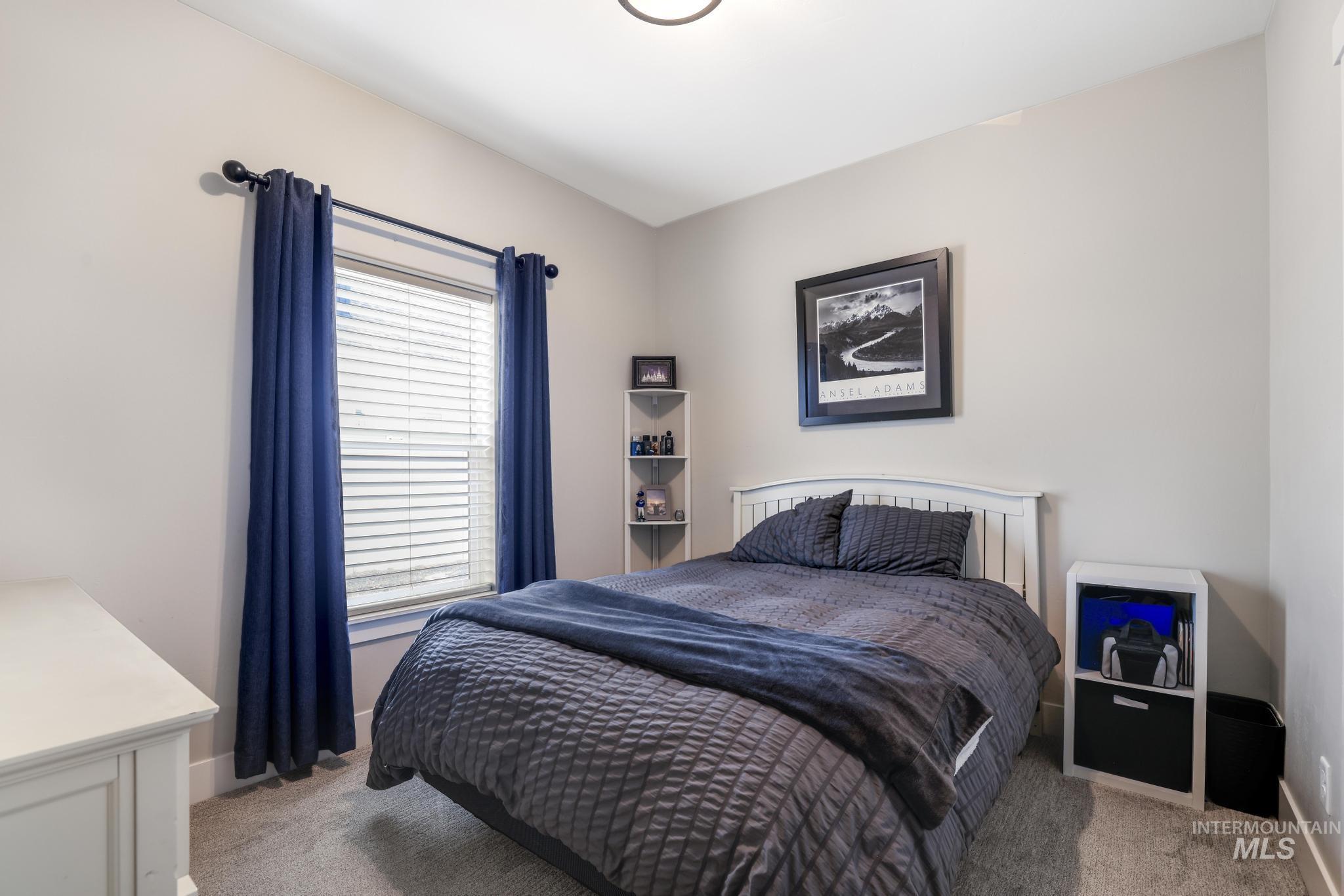 3103 Moonrise Road Twin Falls, ID 83301 - Photo 25 of 42 Bedroom with light carpet and baseboards