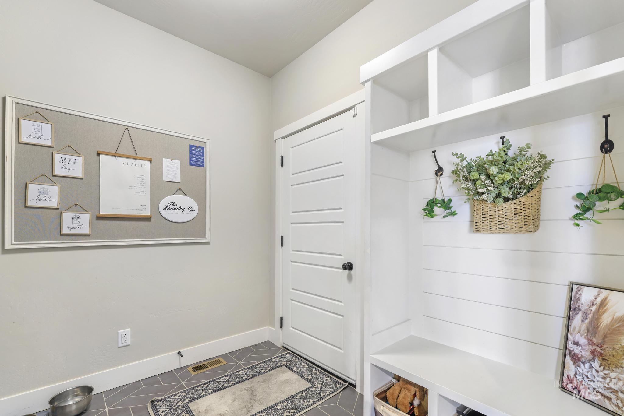 3103 Moonrise Road Twin Falls, ID 83301 - Photo 32 of 42 Mudroom with baseboards and dark tile patterned floors