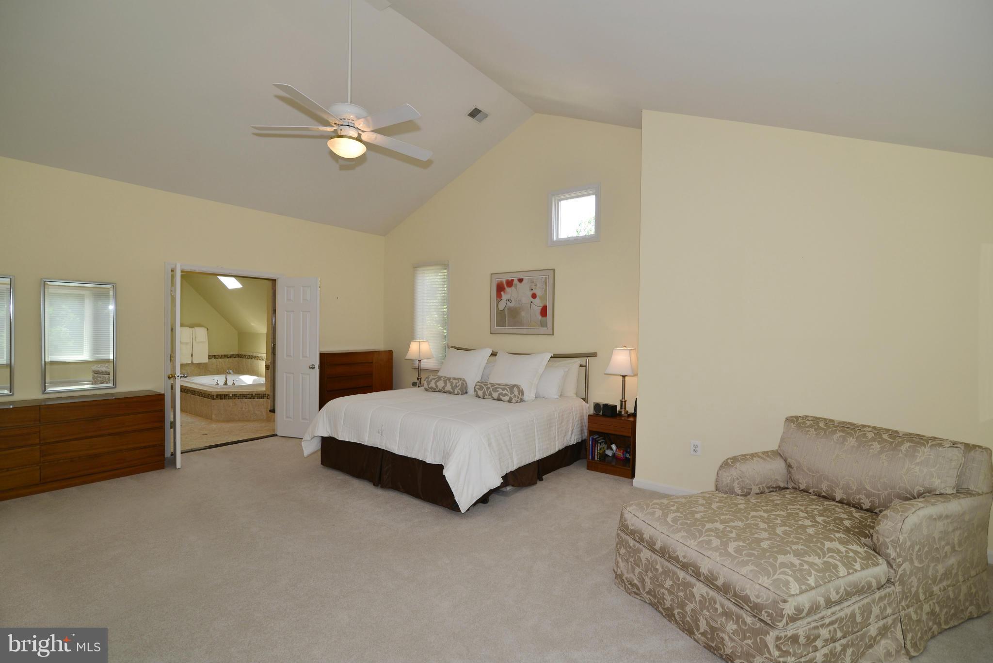 2015 Beacon Place Reston, VA 20191 - Photo 15 of 22 a spacious bedroom with a bed and furniture