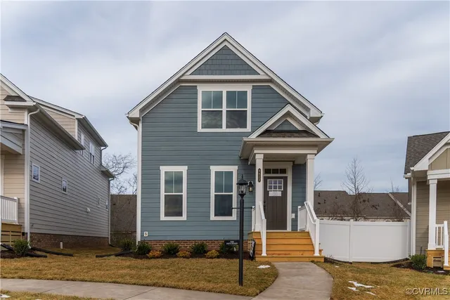 a front view of a house with garage