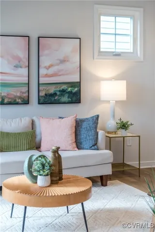 a living room with furniture and a painting