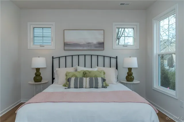 a bedroom with a bed and window