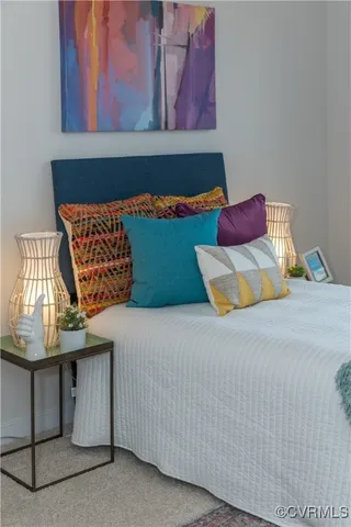 a bedroom with a bed and window