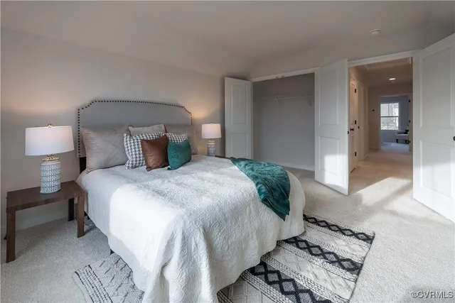 a bedroom with a bed and a lamp