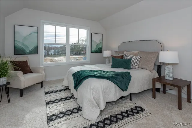 a bedroom with a bed and a couch