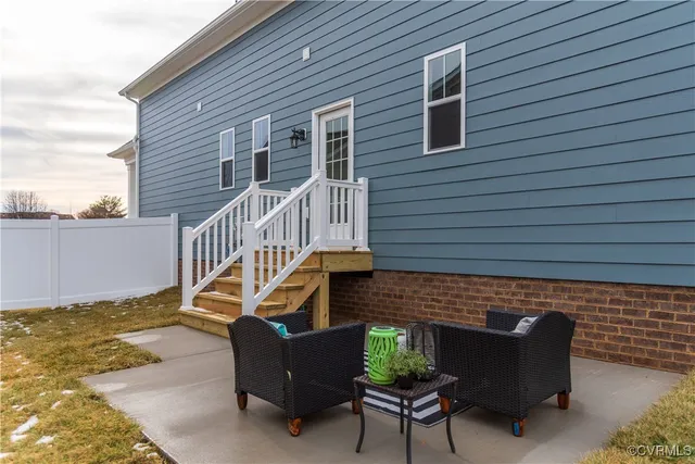 a backyard of a house with outdoor seating
