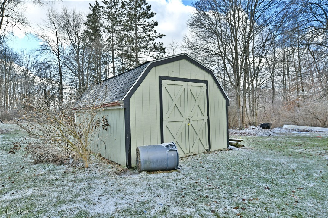 6370 Stewart Sharon Road Hubbard, OH 44425 - Photo 16 of 19 Snow covered structure featuring a lawn