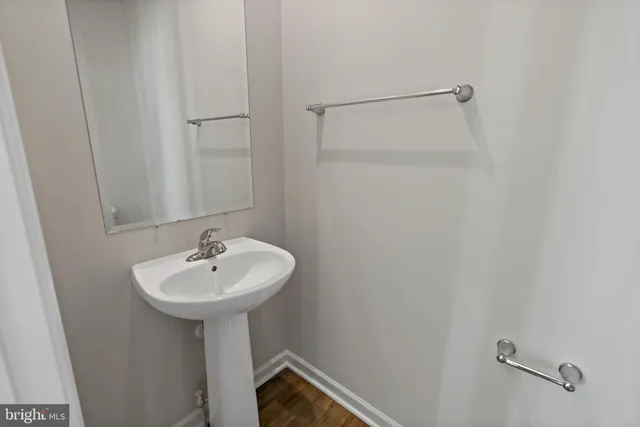a bathroom with a sink a mirror and a bathtub