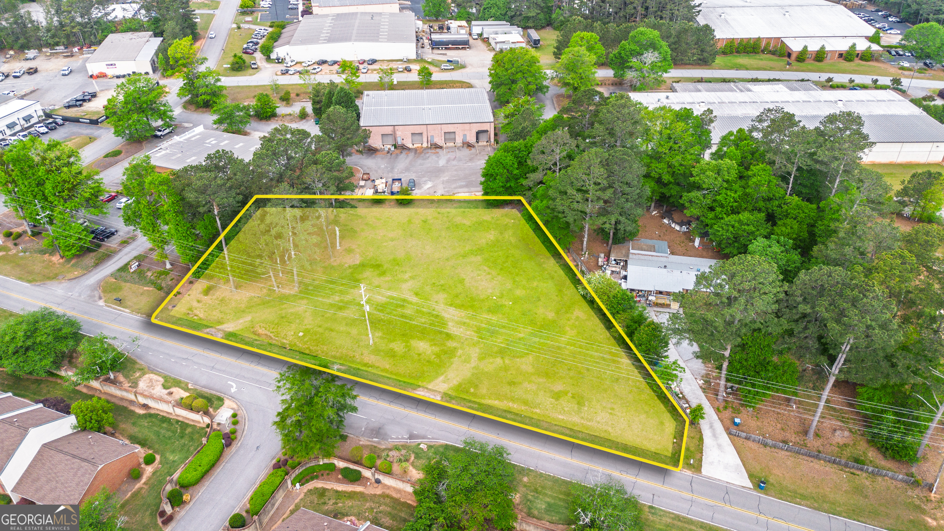 a view of swimming pool with a garden and plants