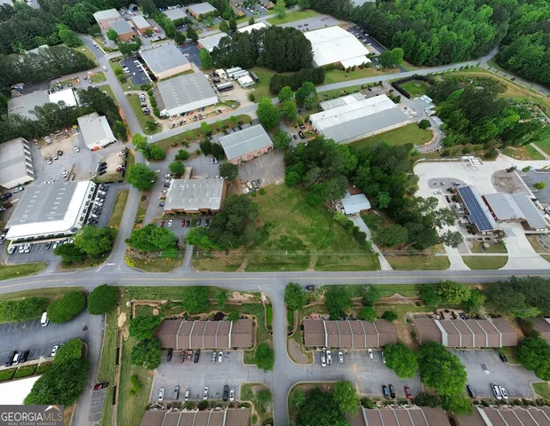 an aerial view of residential house with outdoor space and parking