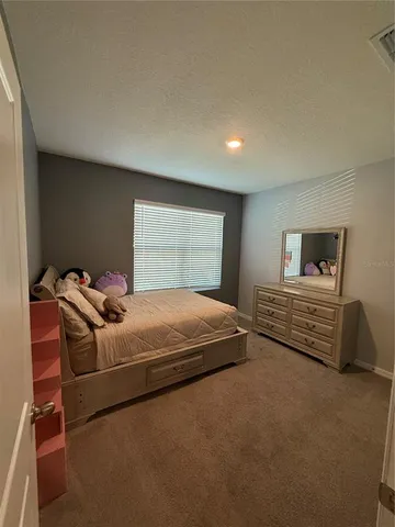 a bathroom with a sink a toilet a shower and a mirror