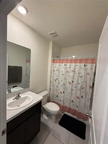 a room with furniture and a flat screen tv