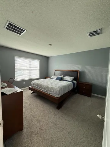 a view of hallway with furniture and a window