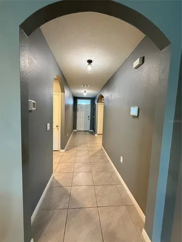 a view of an empty room and closet area